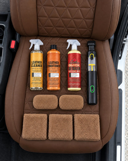 First Class Cleaning Kit laid out on a saddle brown leather seat cover