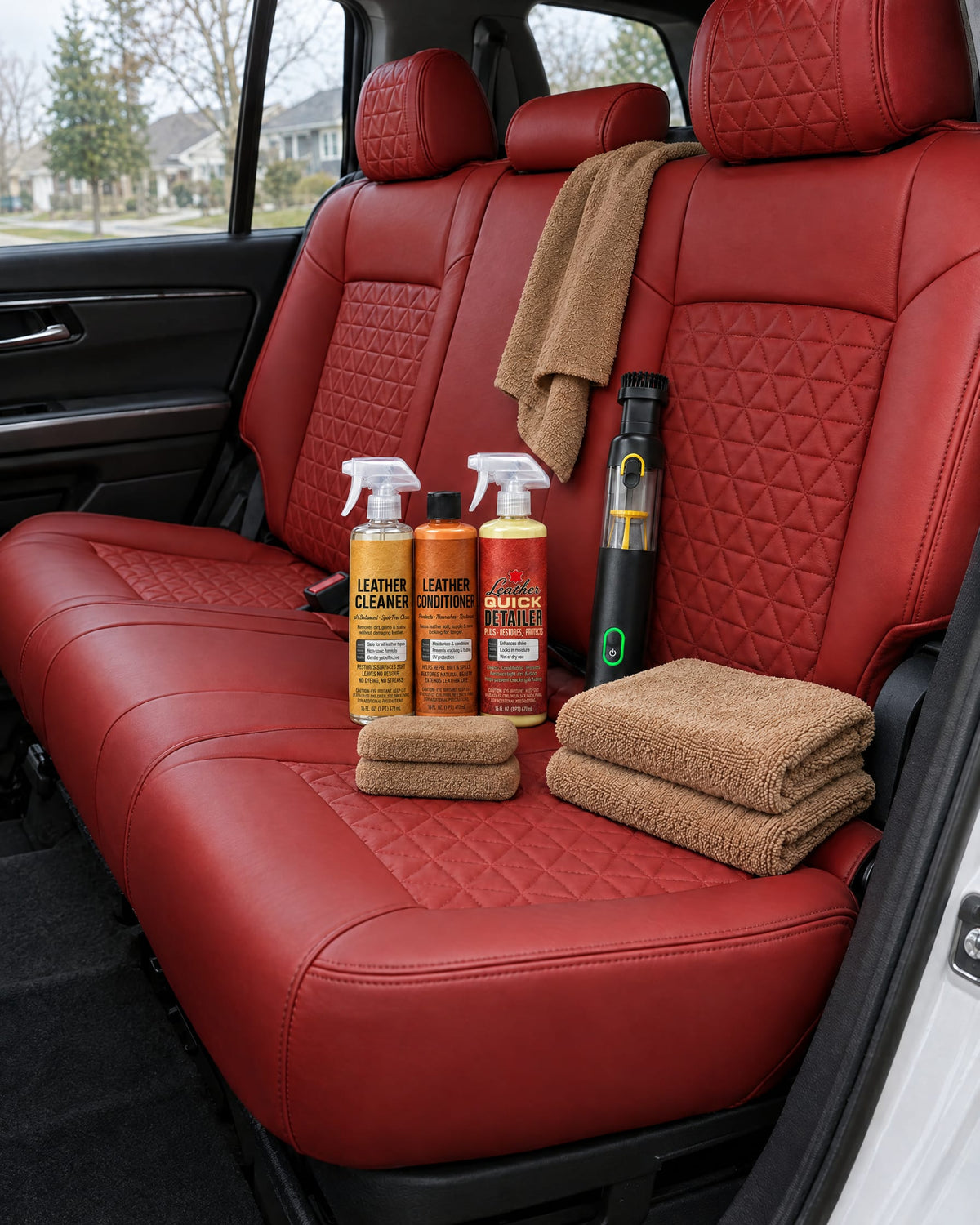 First Class Cleaning Kit on a red custom leather rear seat